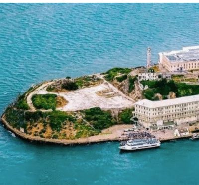 Alcatraz Island with former prison building surrounded by San Francisco Bay waters