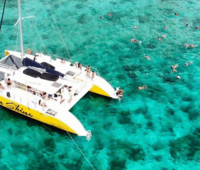 Group of people enjoying a lively catamaran party off the coast of Jamaica