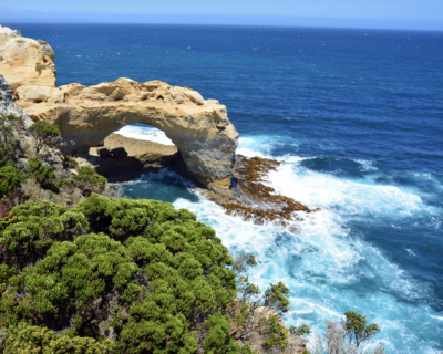 London Arch rock formation along the Great Ocean Road with blue ocean water