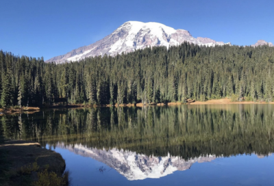 Mountain hiking trail winding through alpine terrain with scenic overlooks