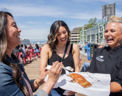 Group of people enjoying a guided food tour, sampling dishes and exploring local cuisine