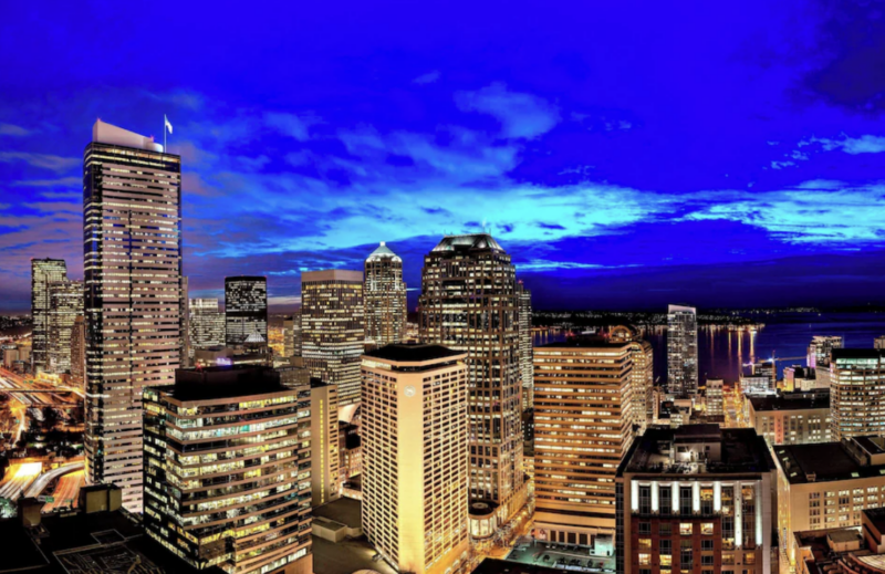 Sheraton Grand Seattle hotel towering above downtown streets with glass and concrete exterior