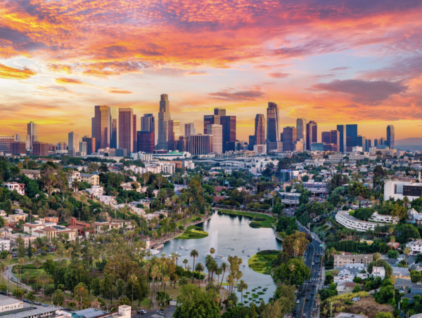 Wide view of the Los Angeles skyline with high-rise buildings under a clear sky