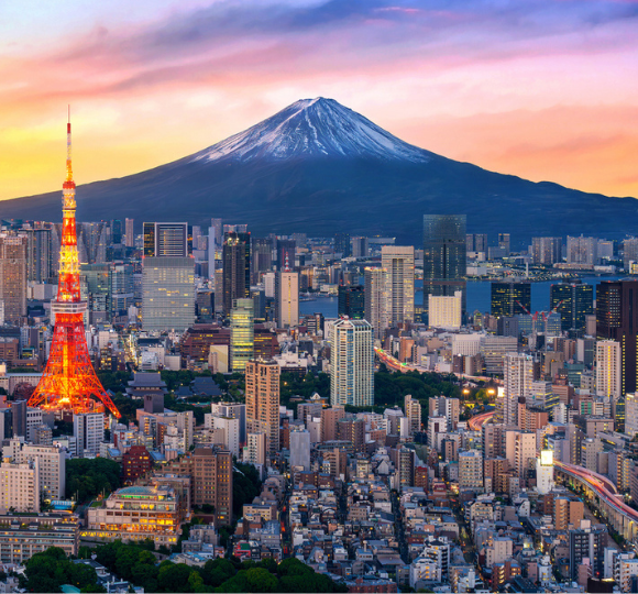 Tokyo city skyline with modern skyscrapers, busy streets, and bright city lights.