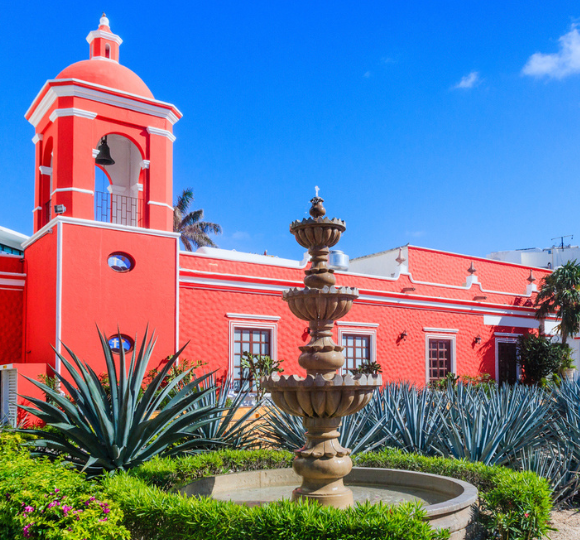 Colorful buildings and lively street scene in downtown Cancun